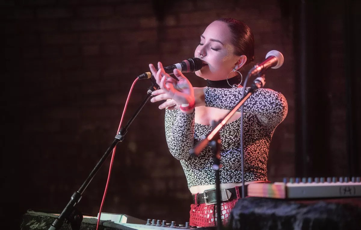 Singer Sudie performs live.