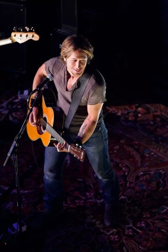 Keith Urban and his guitar onstage in Dallas.