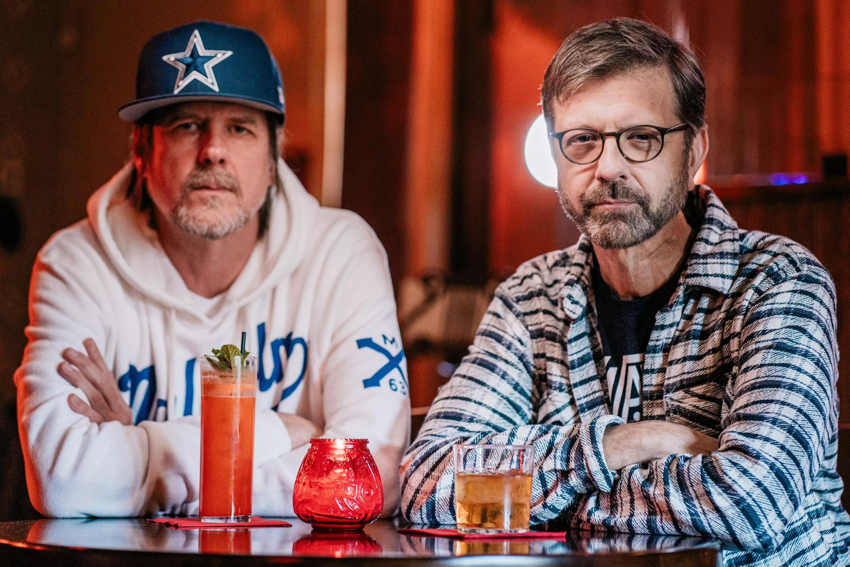 Former Bastards of Soul bassist Danny Balis (left) and producer Jeff "Skin" Wade sit in a Dallas bar.