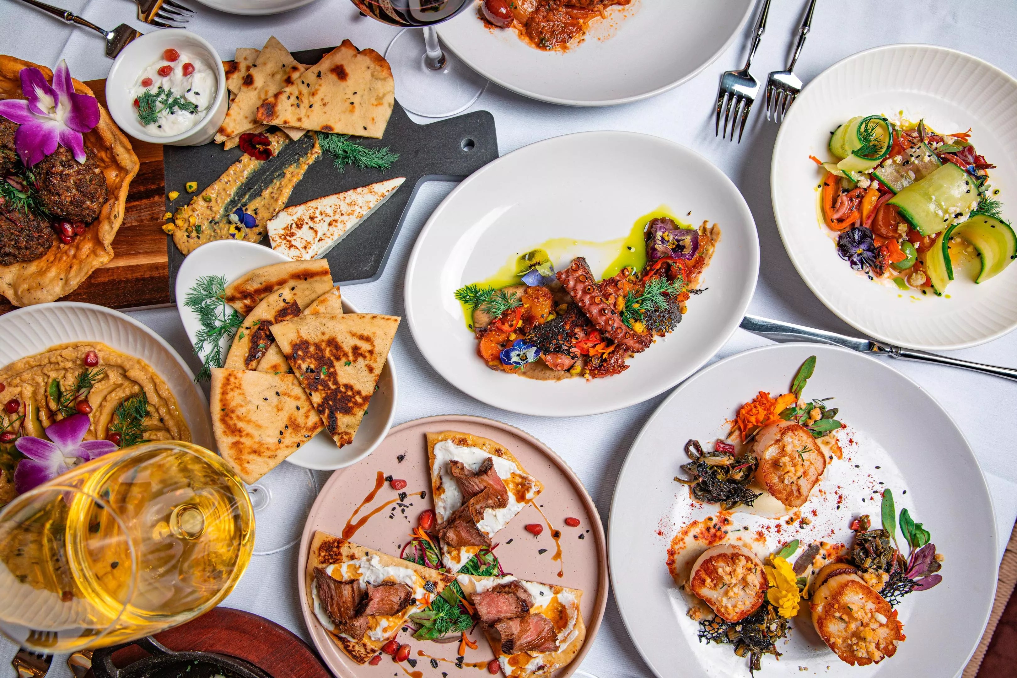 a spread of dishes at Nikki Greek