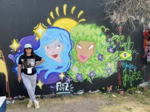 Brazilian-born graffiti artist Fernanda Ferfetz in front of one of her Dallas murals.