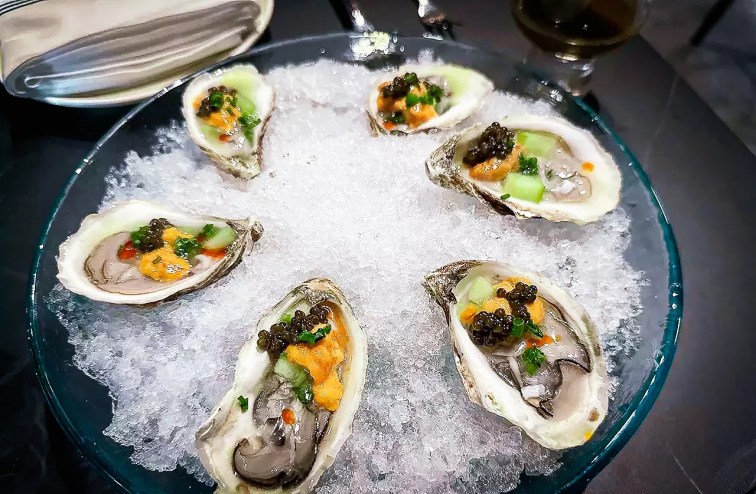 The House Royal Oysters are topped with a bit of caviar.