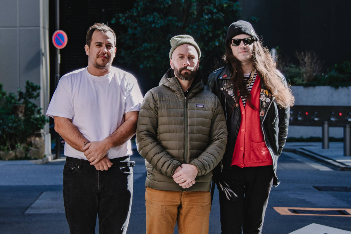 Bandmates standing together