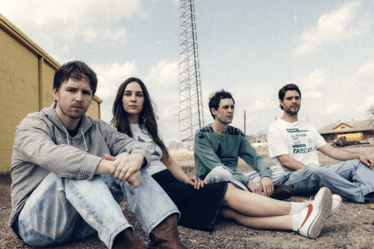 Band sitting down on the ground