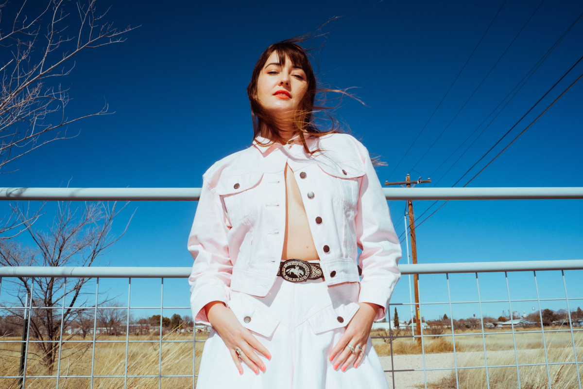 Woman in front of ranch