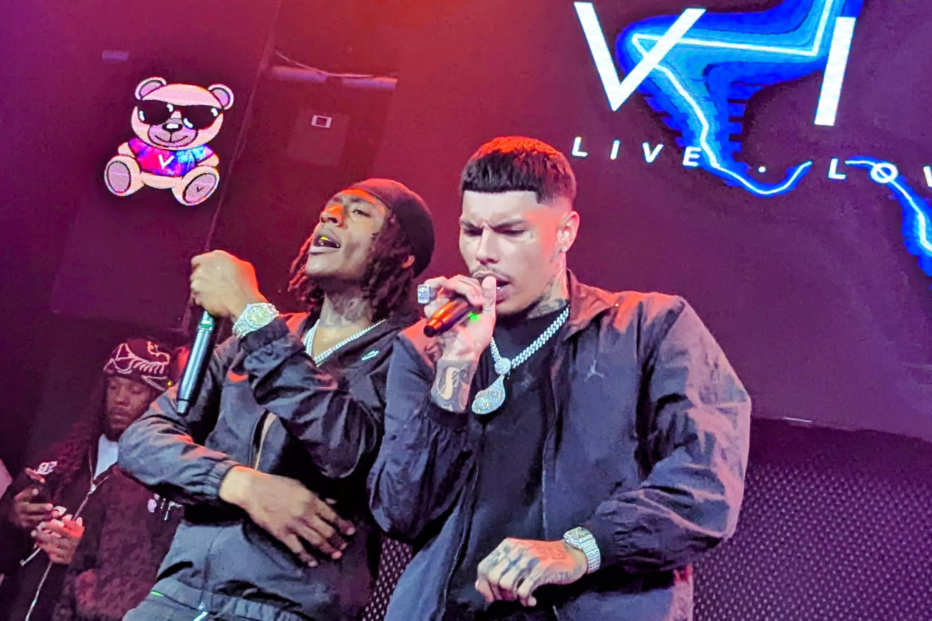 Man performing with his friend on stage