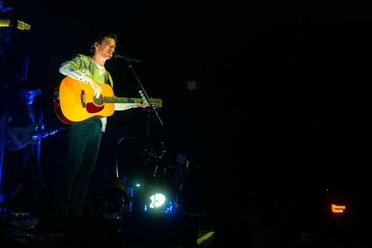 Man performing with guitar
