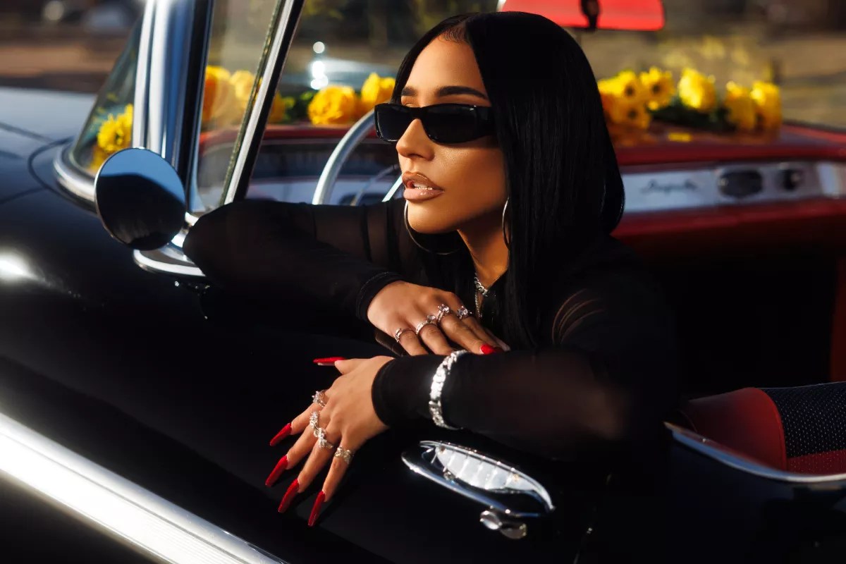 Woman posing in a car