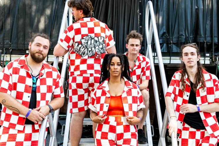 Photo of band posing for a picture