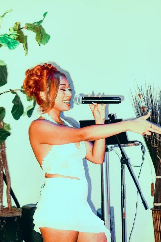 Woman singing on stage